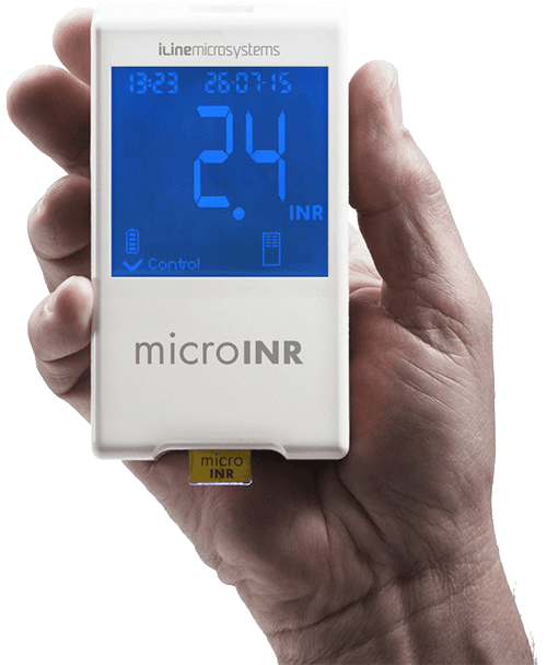 Hand holding the microINR analyser